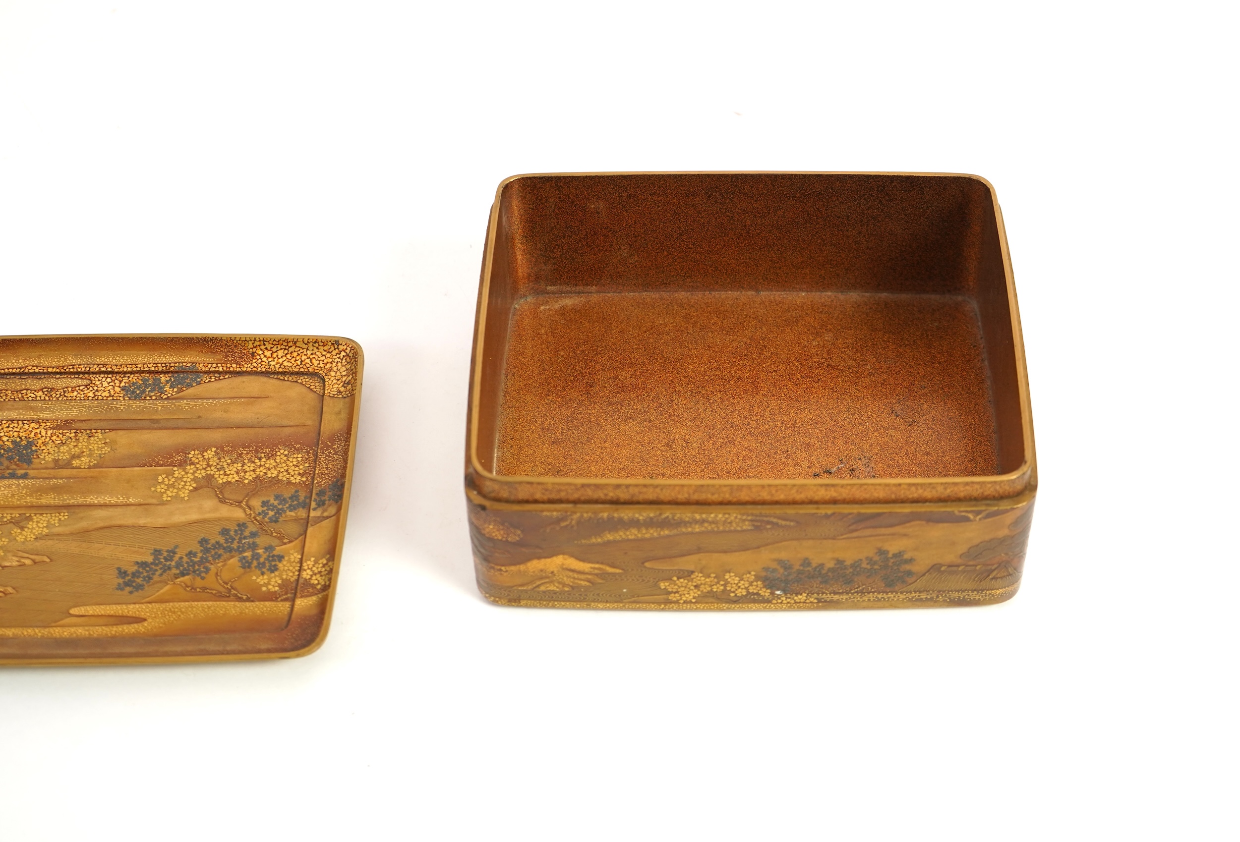 A Japanese gold lacquer ‘landscape’ box, tray and cover, 19th century
